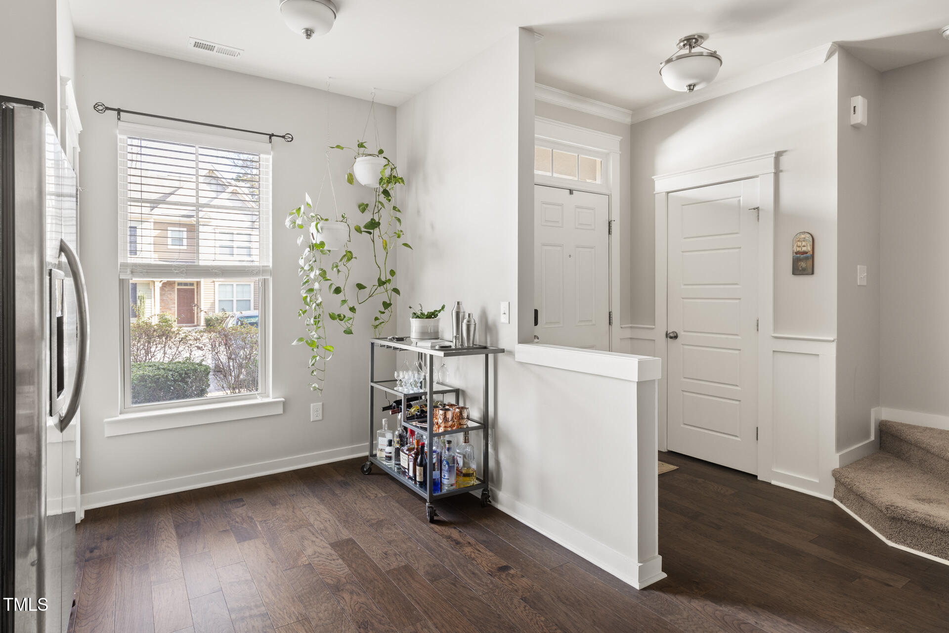 7832 Allscott Way Raleigh, NC 27612 - Photo 5 of 33 an entryway with a window and wooden floor