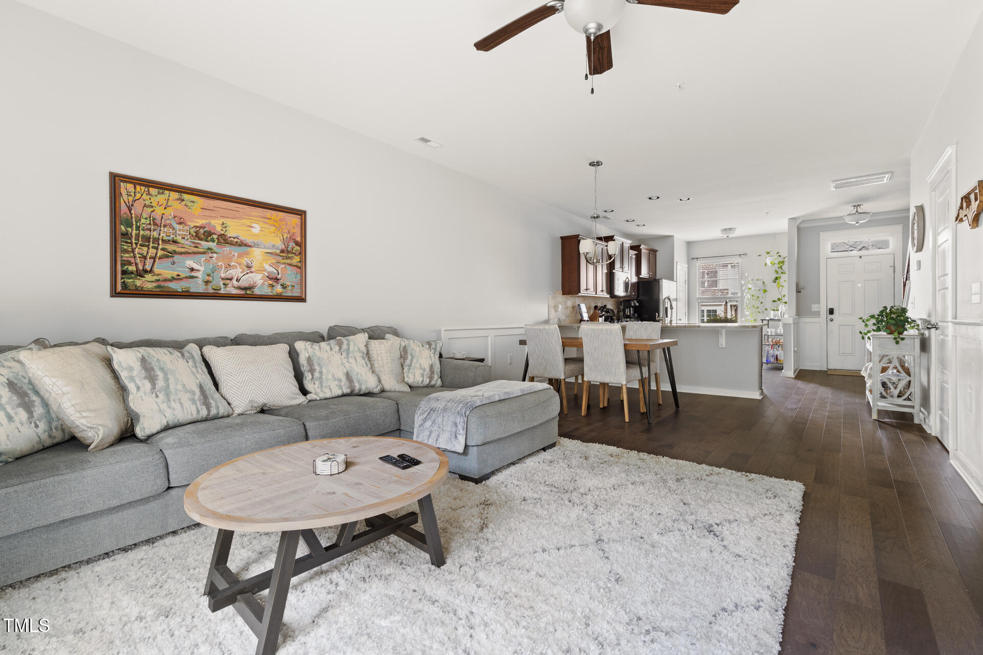 7832 Allscott Way Raleigh, NC 27612 - Photo 6 of 33 a living room with furniture and a wooden floor