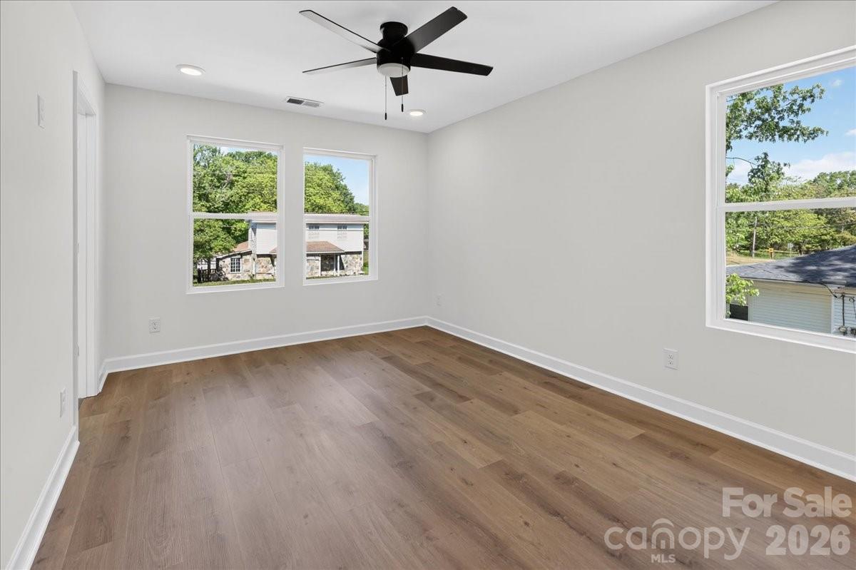 2108 Moose Road Kannapolis, NC 28081 - Photo 13 of 22 a view of an empty room with wooden floor and a window