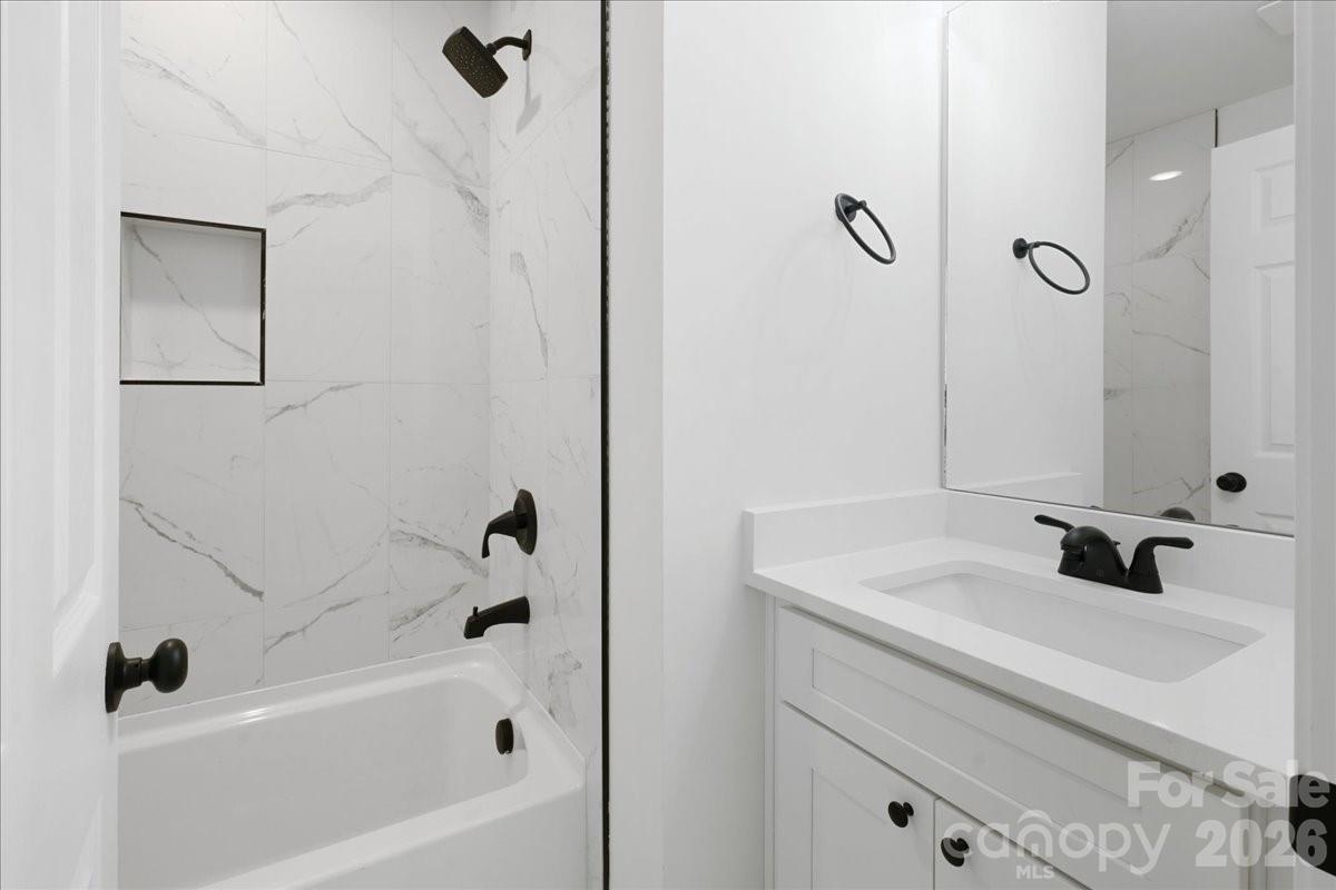 2108 Moose Road Kannapolis, NC 28081 - Photo 19 of 22 a bathroom with a sink a toilet and a bathtub