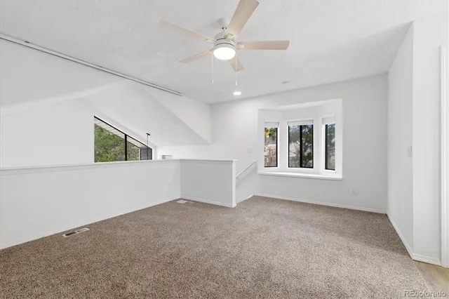 a view of an empty room with windows