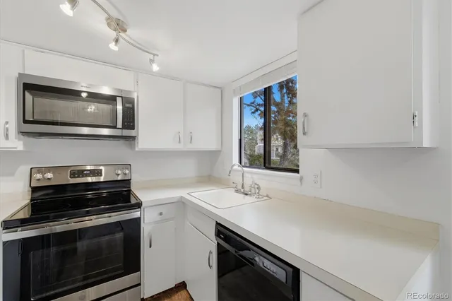 a kitchen with a stove and a microwave