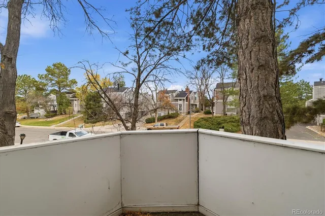 a view of a house with a tree