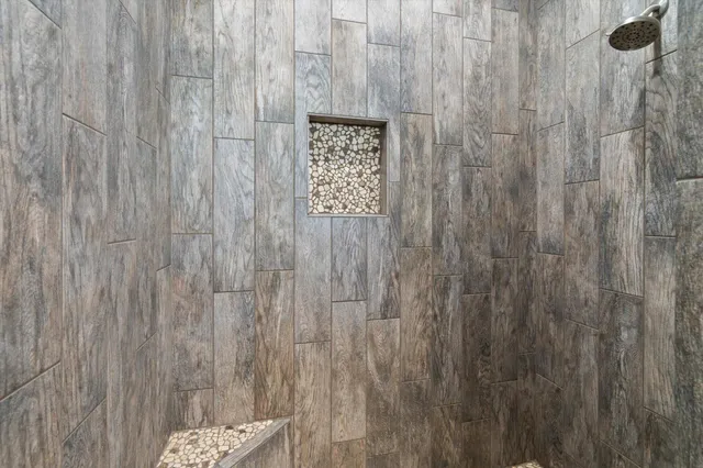 a view of a bathroom with a shower curtain and a shower