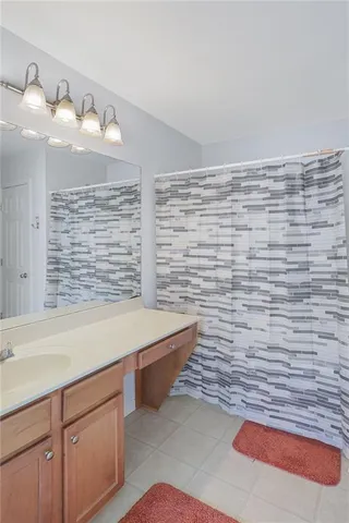 a bathroom with a sink and a shower