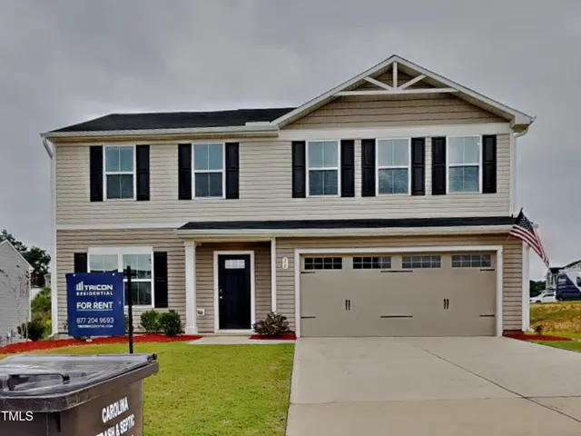 a front view of a house with swimming pool