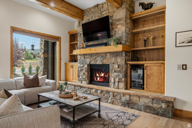 4892 Eagle Rdg Drive Eden, UT 84310 - Photo 4 of 39 Stone fireplace with an integrated wood-mantle and built-in shelving