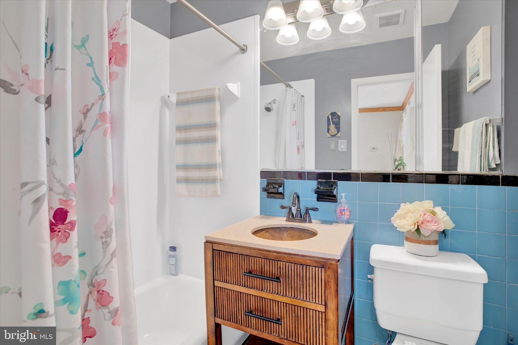 3805 Swann Road, Unit 304 Suitland, MD 20746 - Photo 11 of 16 a bathroom with a sink mirror and vanity