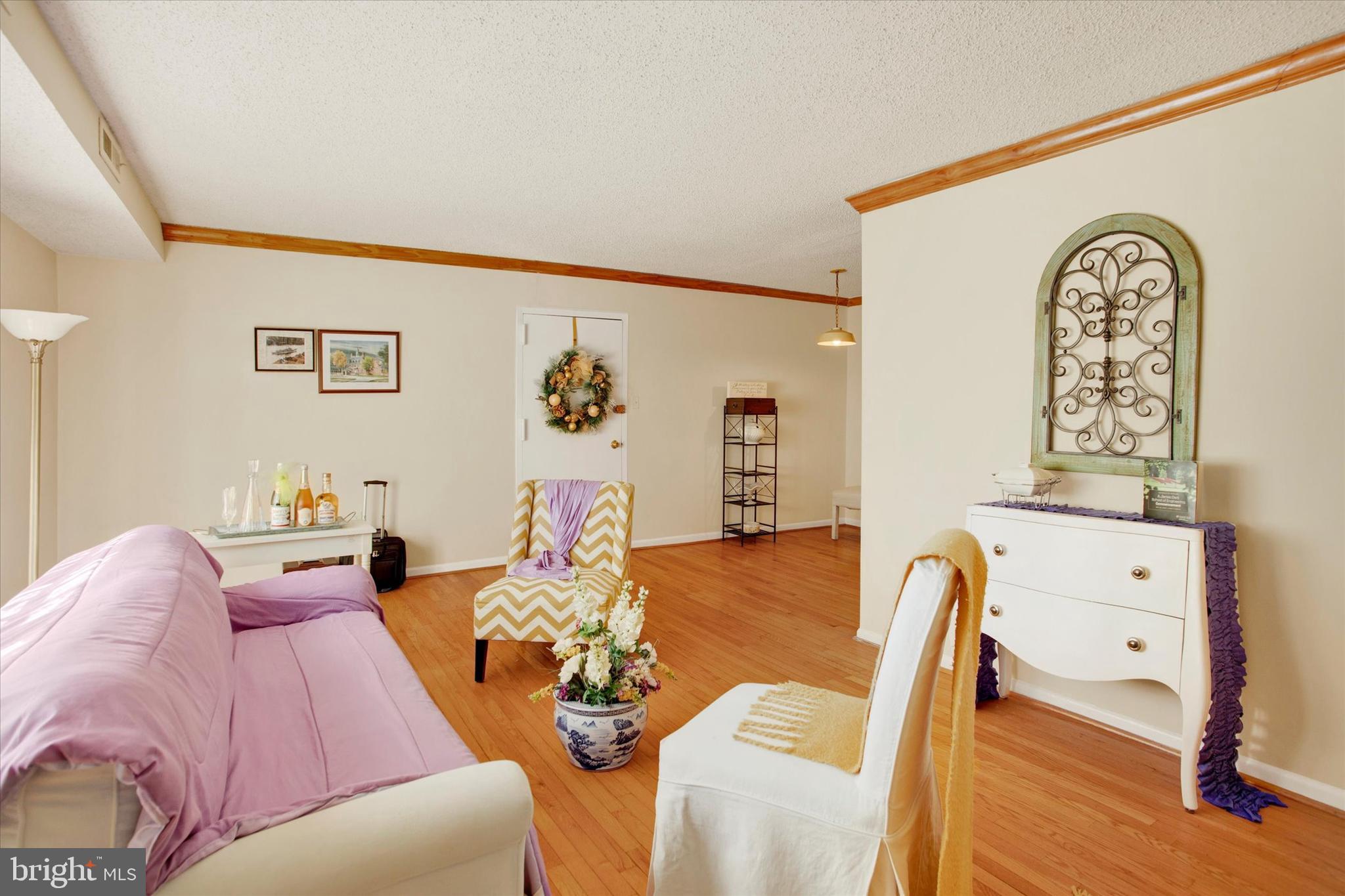 3805 Swann Road, Unit 304 Suitland, MD 20746 - Photo 10 of 16 a living room with furniture and wooden floor