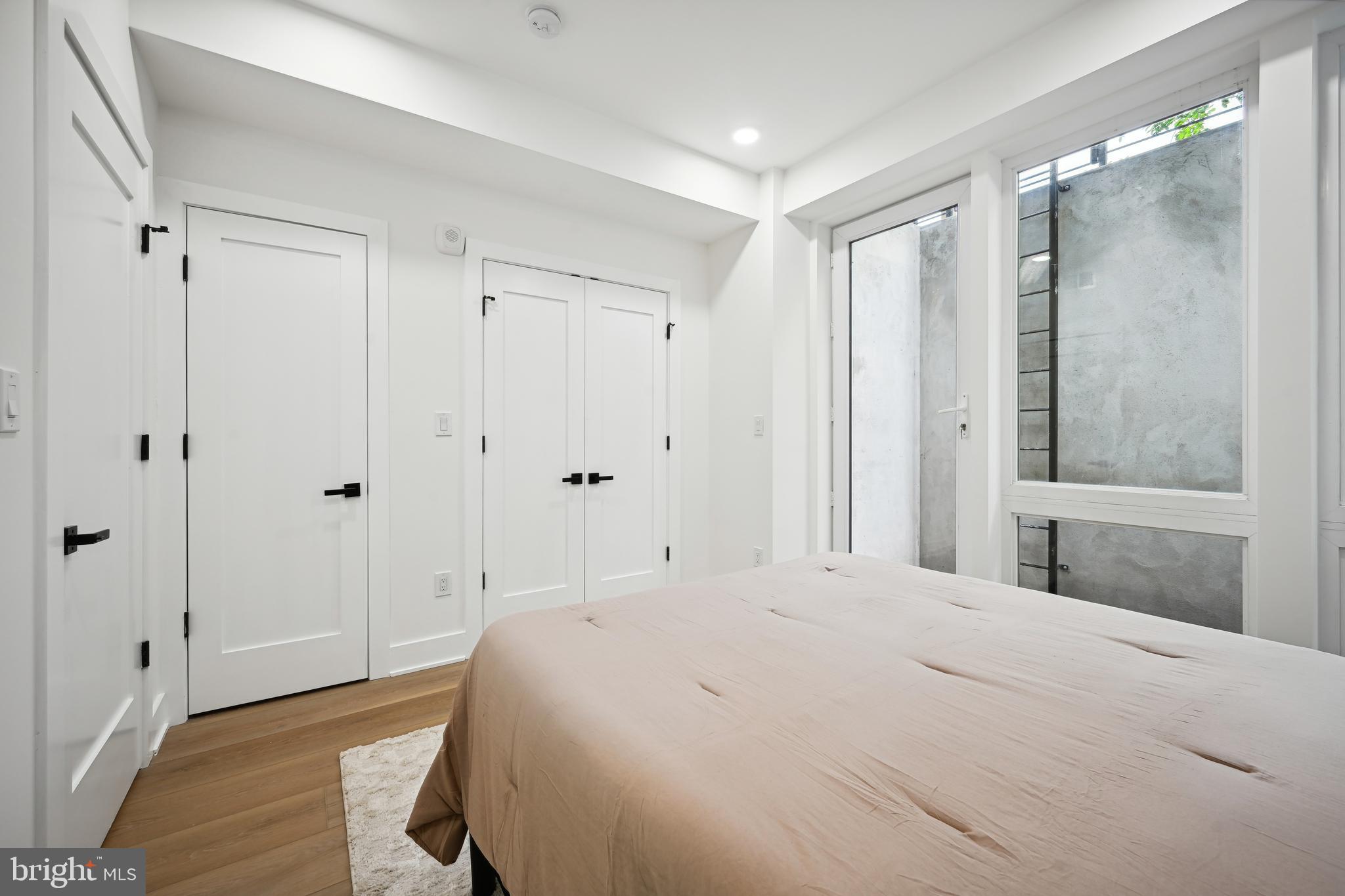 1372 Bryant Street Northeast, Unit 2 Washington, DC 20018 - Photo 11 of 22 a bedroom with a bed and a shower