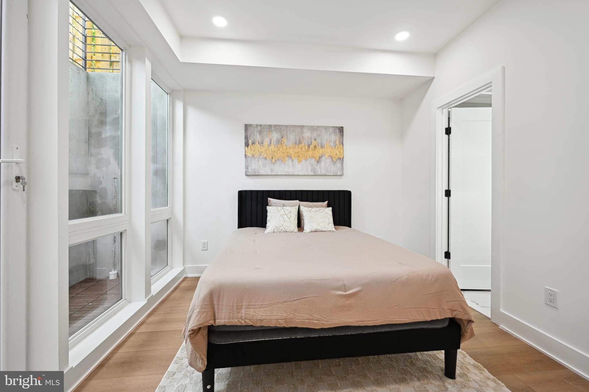 1372 Bryant Street Northeast, Unit 2 Washington, DC 20018 - Photo 12 of 22 a large white bed in a white room