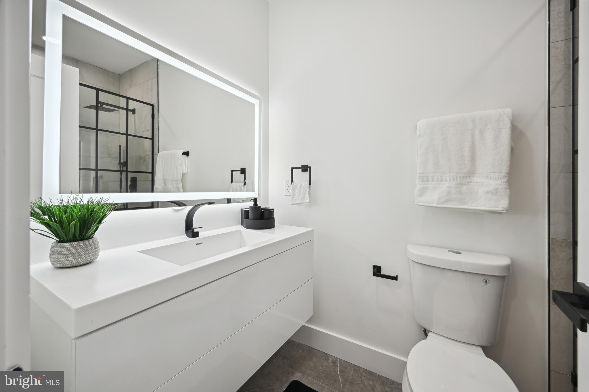 1372 Bryant Street Northeast, Unit 2 Washington, DC 20018 - Photo 13 of 22 a bathroom with a sink and a toilet