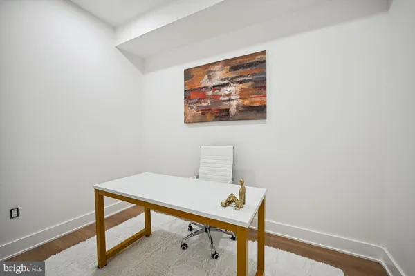 a view of a workspace with furniture