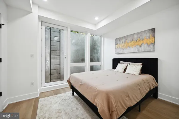 a bedroom with a large bed and a window