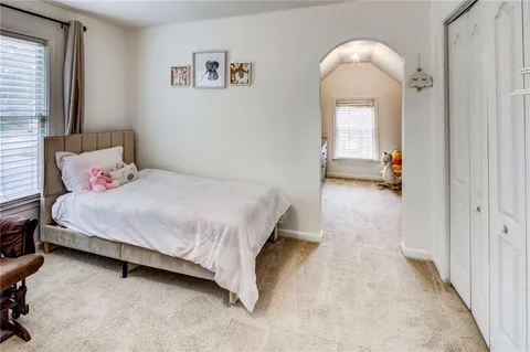 a view of a livingroom with car and window