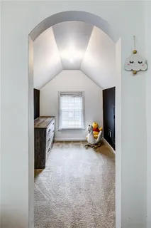 a bedroom with a bed and a table