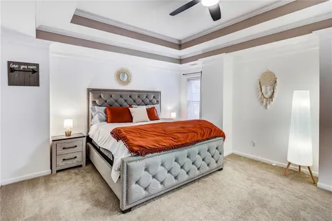 a bathroom with a tub shower sink and mirror