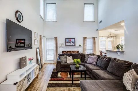a kitchen with granite countertop a sink stove and cabinets