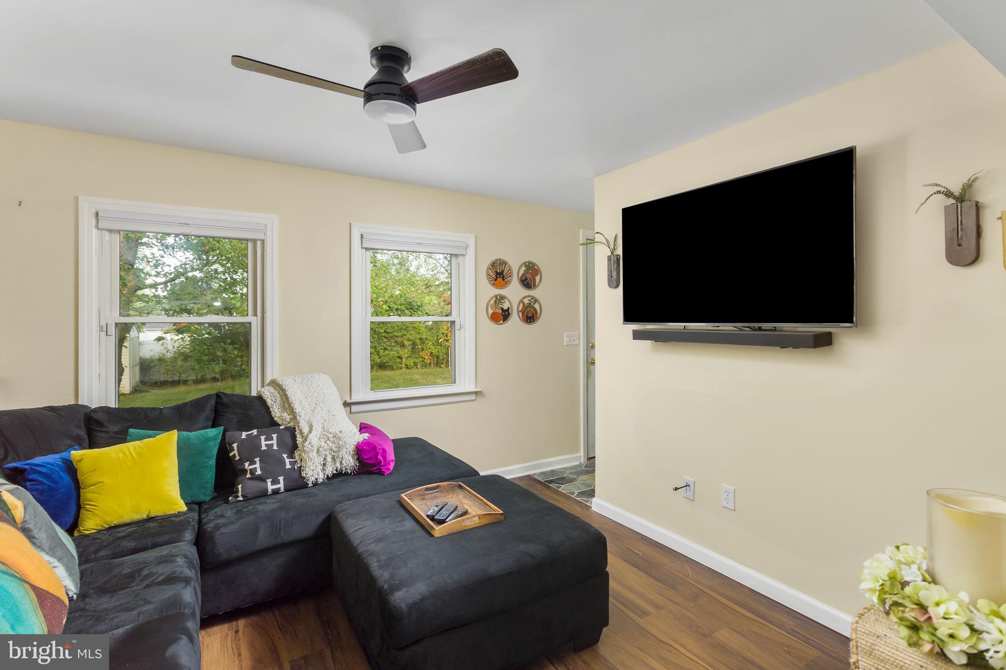 227 Princeton Avenue Hamilton, NJ 08619 - Photo 13 of 41 a living room with furniture and a flat screen tv