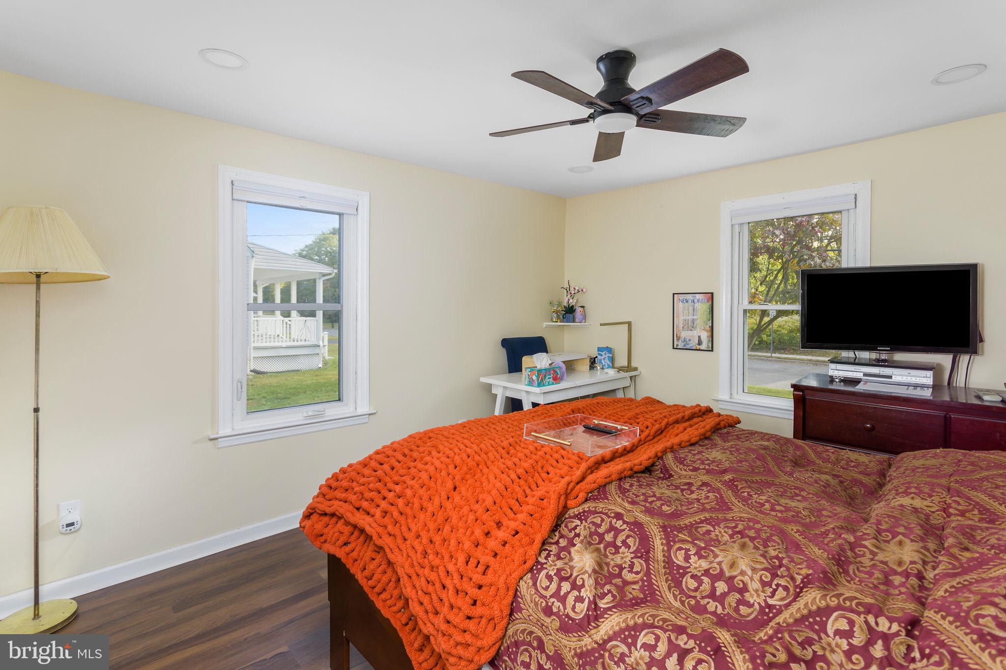 227 Princeton Avenue Hamilton, NJ 08619 - Photo 15 of 41 a bedroom with a bed and a flat screen tv