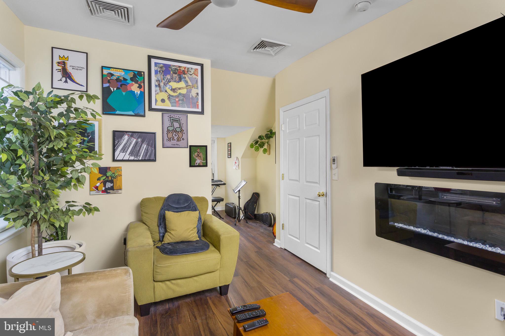 227 Princeton Avenue Hamilton, NJ 08619 - Photo 20 of 41 a living room with furniture and a flat screen tv