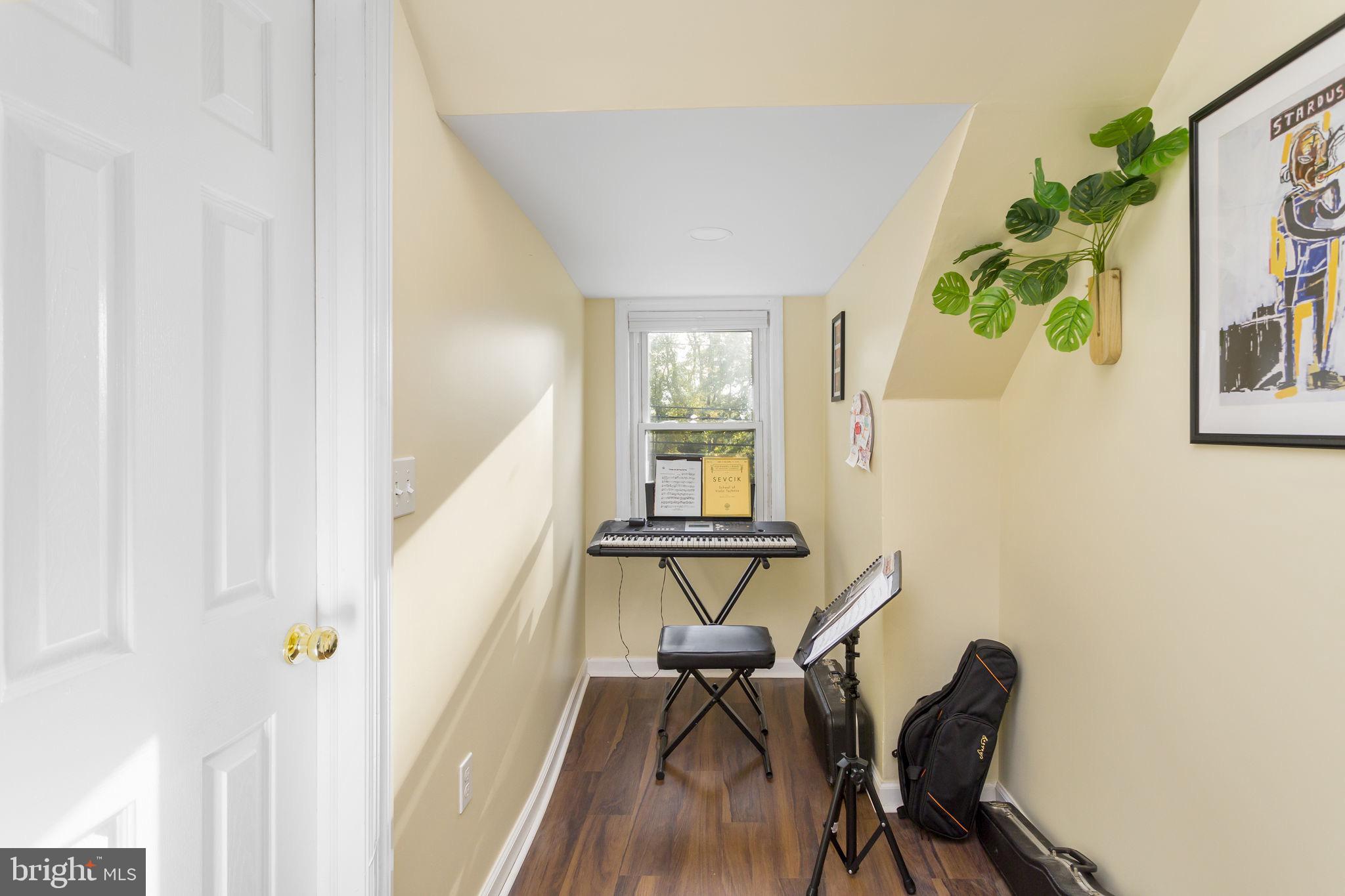 227 Princeton Avenue Hamilton, NJ 08619 - Photo 21 of 41 a view of a hallway with furniture and wooden floor