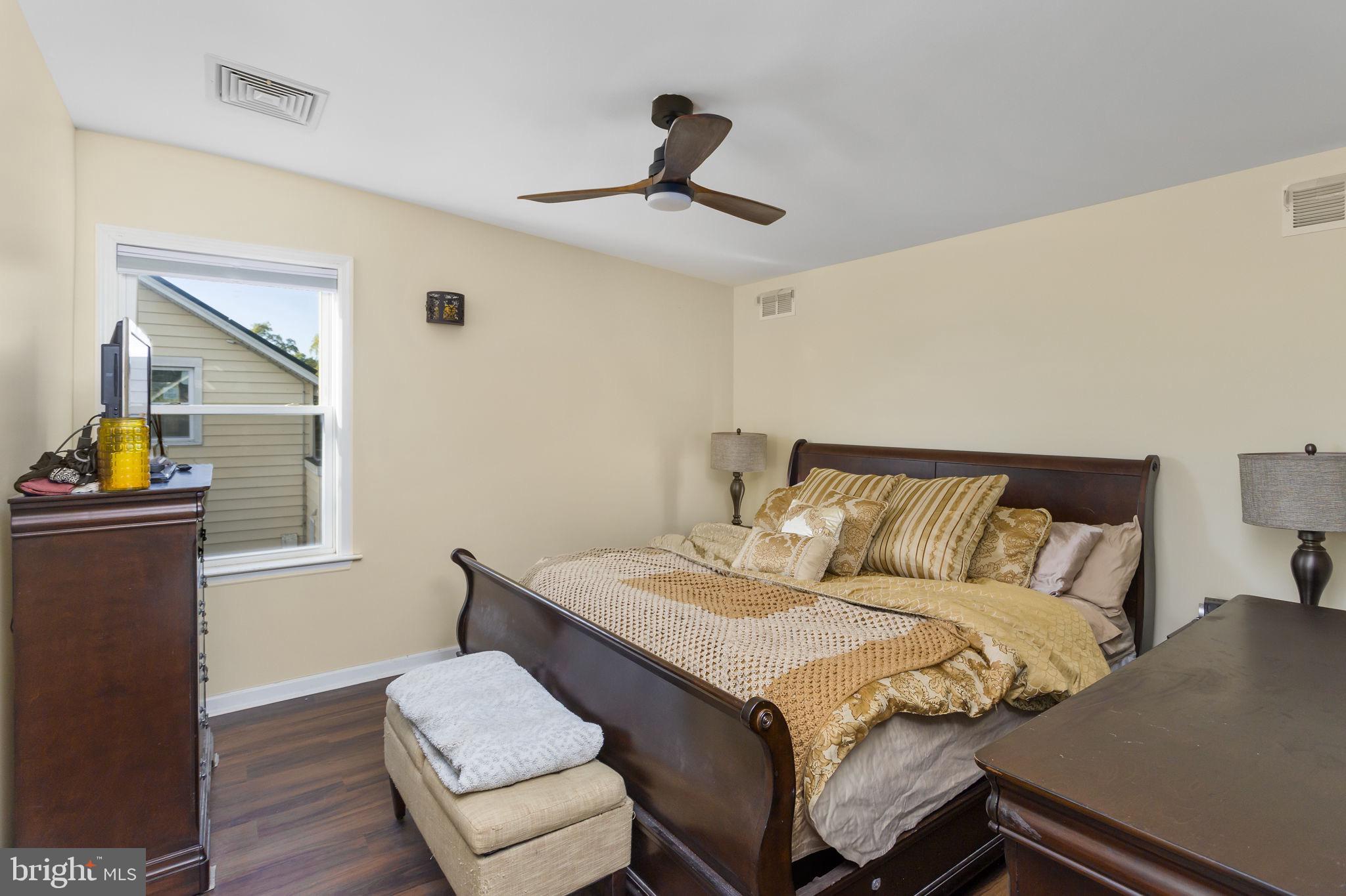 227 Princeton Avenue Hamilton, NJ 08619 - Photo 24 of 41 a bed room with a bed and a couch