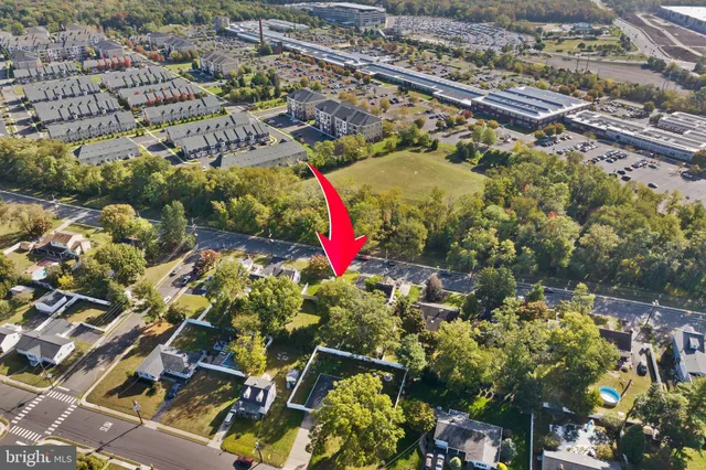 an aerial view of residential building and parking space