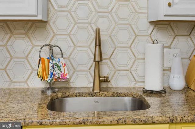 a bathroom with mirror sink and bathtub