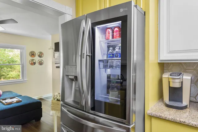 a kitchen with a refrigerator and sink