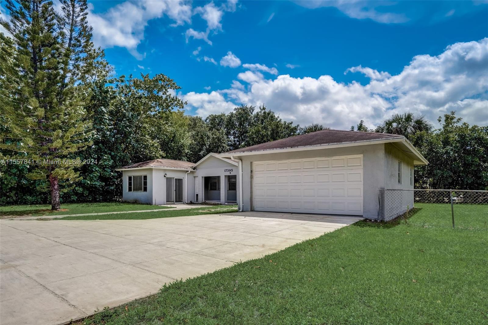 17395 Bendross Road Jupiter, FL 33458 - Photo 1 of 28 a front view of a house with garden