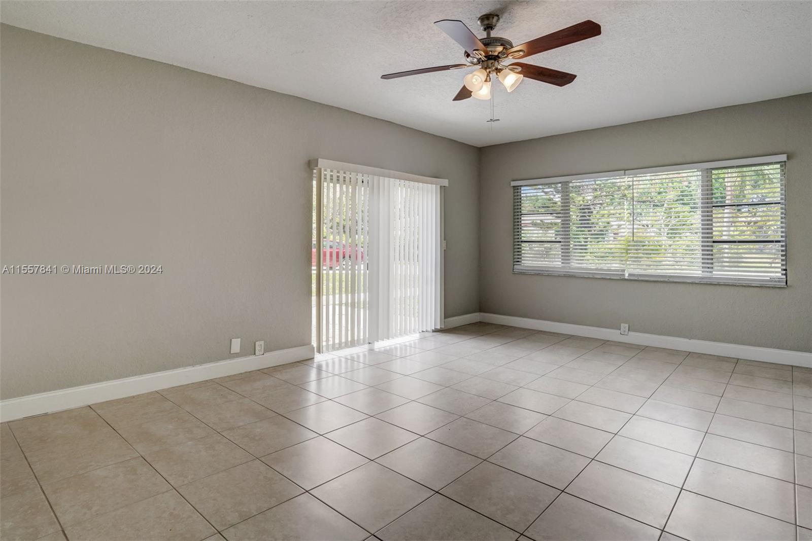 17395 Bendross Road Jupiter, FL 33458 - Photo 3 of 28 a view of an empty room with a window