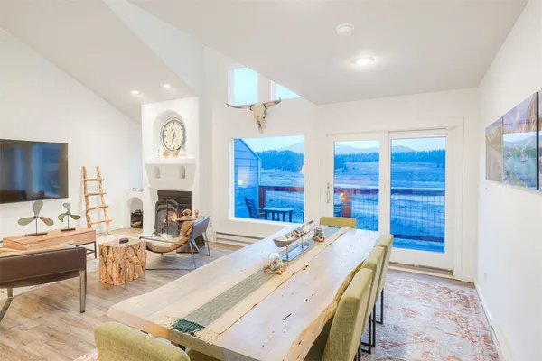 a kitchen with kitchen island white cabinets sink and white appliances