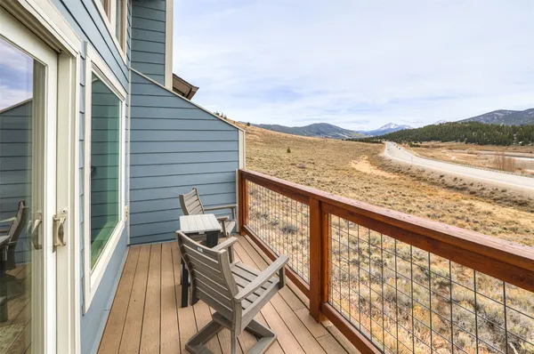 a kitchen with kitchen island white cabinets and white appliances