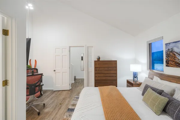 a bathroom with a sink mirror toilet and bathtub