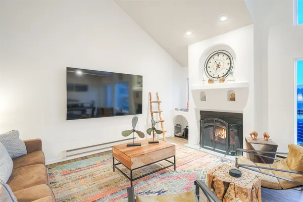 a view of a bedroom with furniture and a fireplace