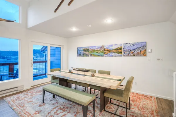 a view of a dining area with furniture and a chandelier