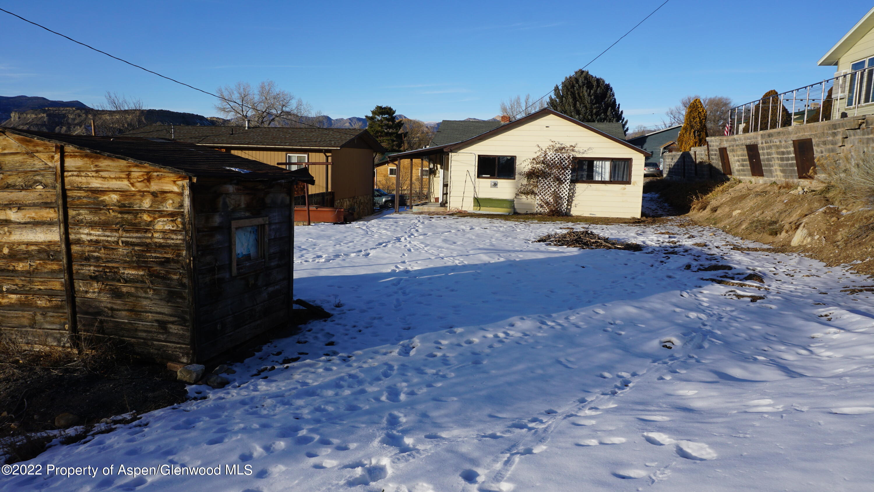 427 East 11th Street Rifle, CO 81650 - Photo 22 of 23 a front view of a house with a yard