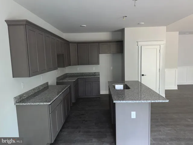 a kitchen with a cabinets and steel appliances