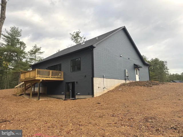 a view of a house with a yard and garage