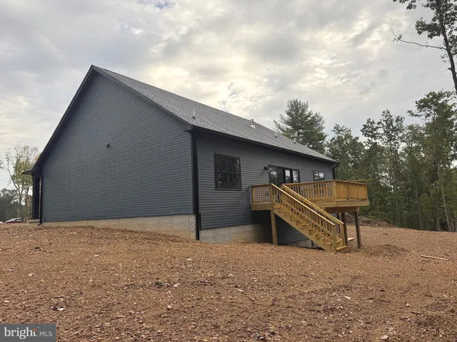a house with trees in the background