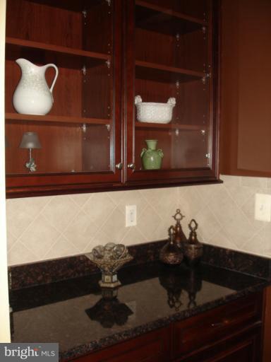 6554 Pebble Brooke Road Baltimore, MD 21209 - Photo 2 of 17 a bathroom with a sink and a mirror