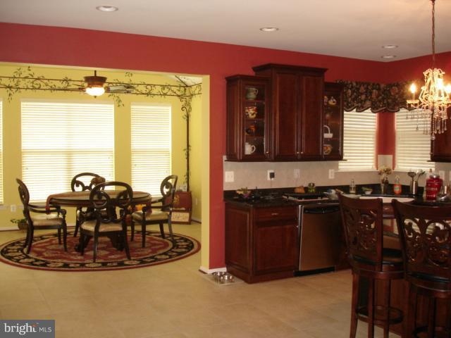 6554 Pebble Brooke Road Baltimore, MD 21209 - Photo 13 of 17 a view of a dining room with furniture