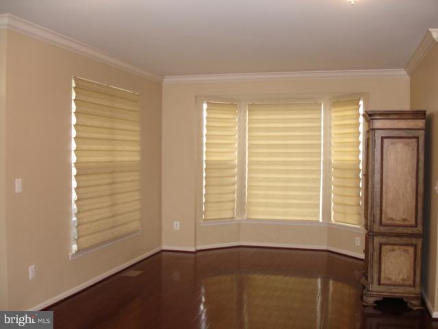 6554 Pebble Brooke Road Baltimore, MD 21209 - Photo 14 of 17 a view of an empty room with a window