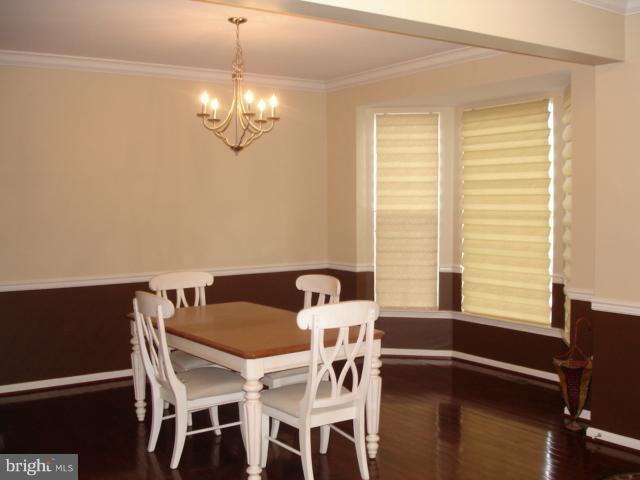 6554 Pebble Brooke Road Baltimore, MD 21209 - Photo 8 of 17 a view of a dining room with furniture and window