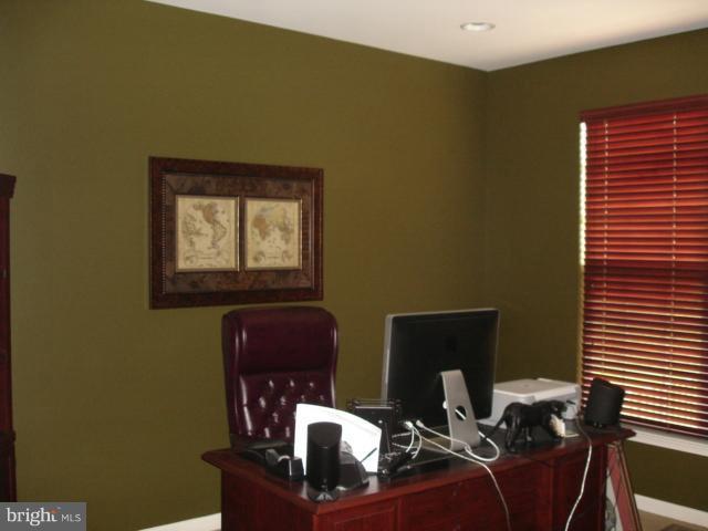 6554 Pebble Brooke Road Baltimore, MD 21209 - Photo 9 of 17 a room with furniture and wooden floor