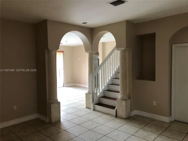 a view of an empty room and window