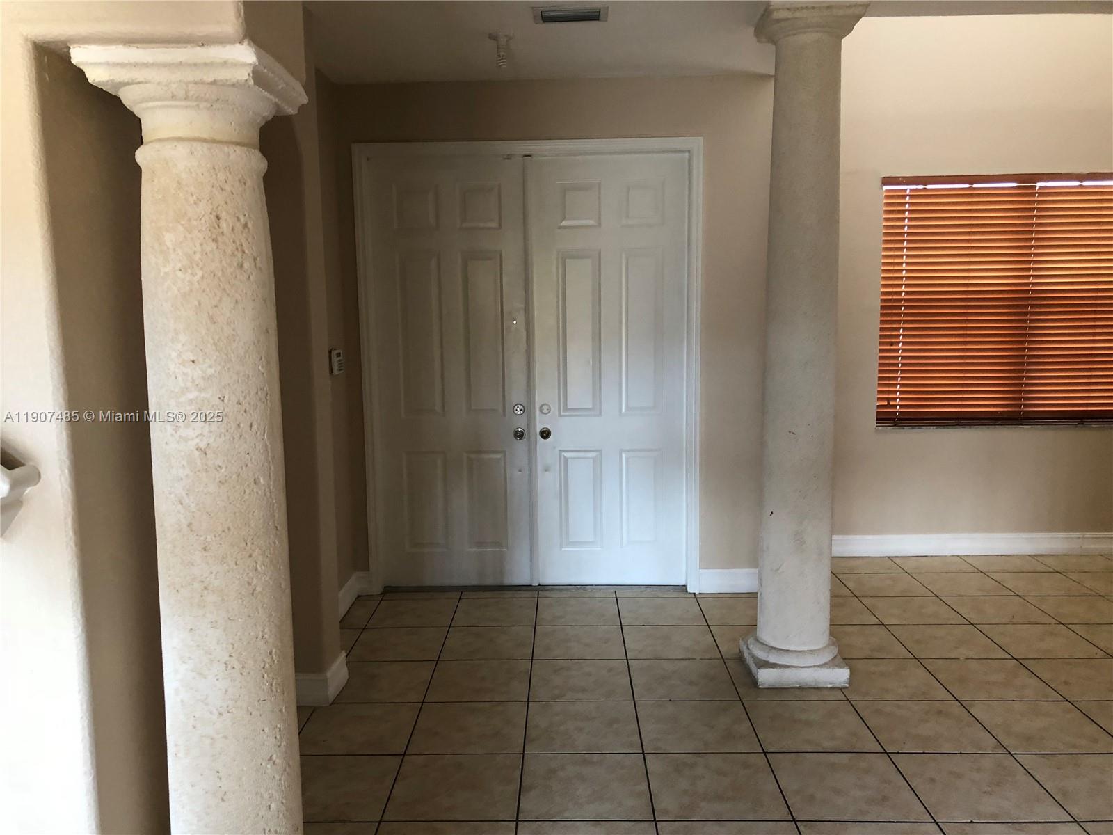 13426 Southwest 177th Terrace Miami, FL 33177 - Photo 17 of 36 a view of an empty room and window