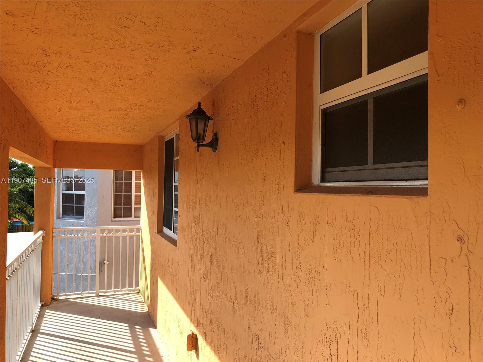 13426 Southwest 177th Terrace Miami, FL 33177 - Photo 21 of 36 a view of a house with a door and a window