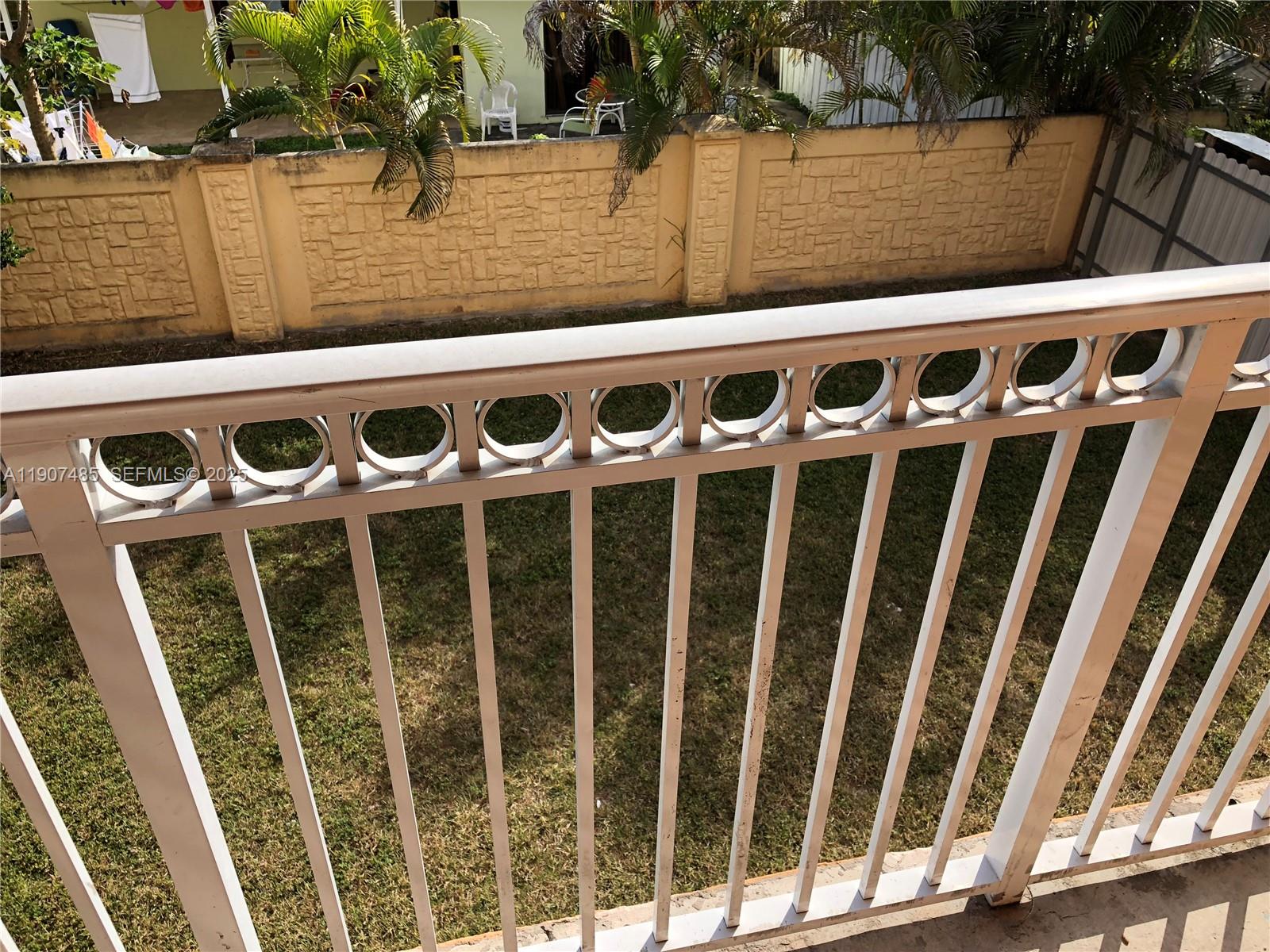 13426 Southwest 177th Terrace Miami, FL 33177 - Photo 24 of 36 a front view of a door with wooden wall